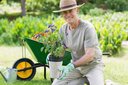 Professional gardeners planting and landscaping in Motspur Park