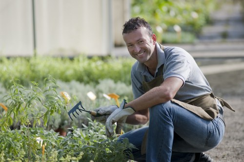 Local gardener planting native species in West Hendon